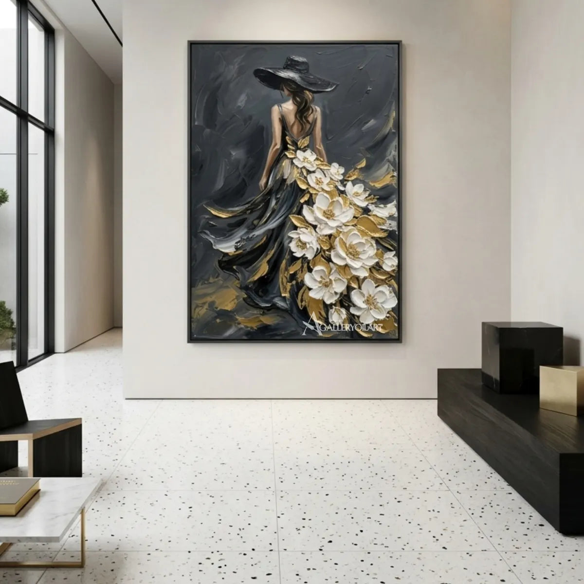 Woman-in-flowing-black-gown-with-white-floral-accents-portrait-art-in-a-modern-corridor-with-neutral-tones