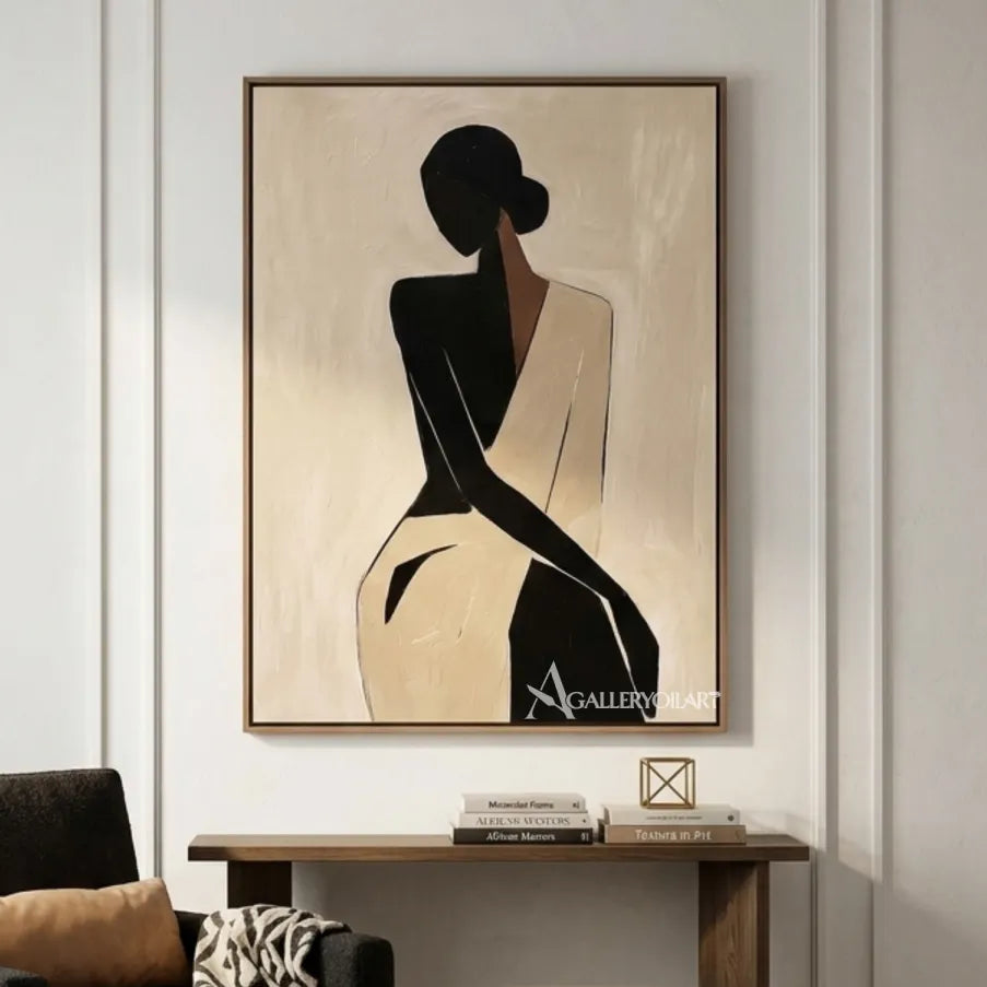 Black-silhouette-of-woman-in-flowing-dress-portrait-art-above-a-console-in-a-minimalist-room