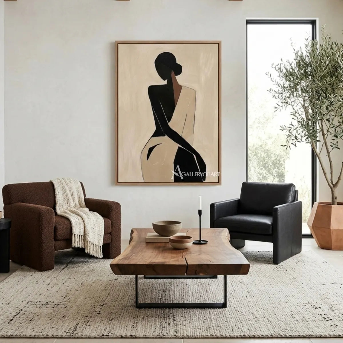 Black-silhouette-of-woman-in-flowing-dress-portrait-art-in-a-contemporary-living-room-with-cream-and-brown