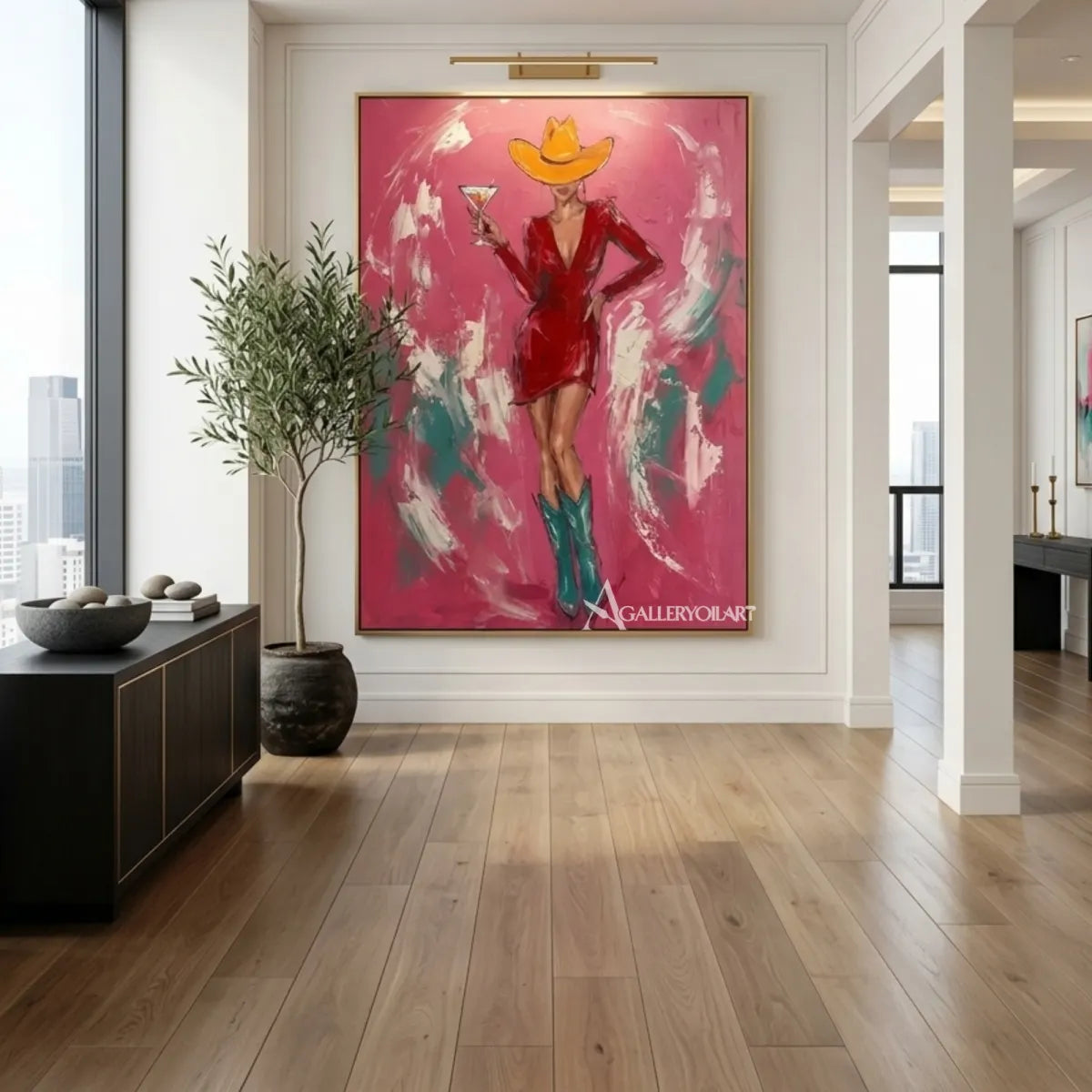 Woman-in-a-cowboy-hat-holding-a-cocktail-in-pop-art-pink-wall-art-in-corridor