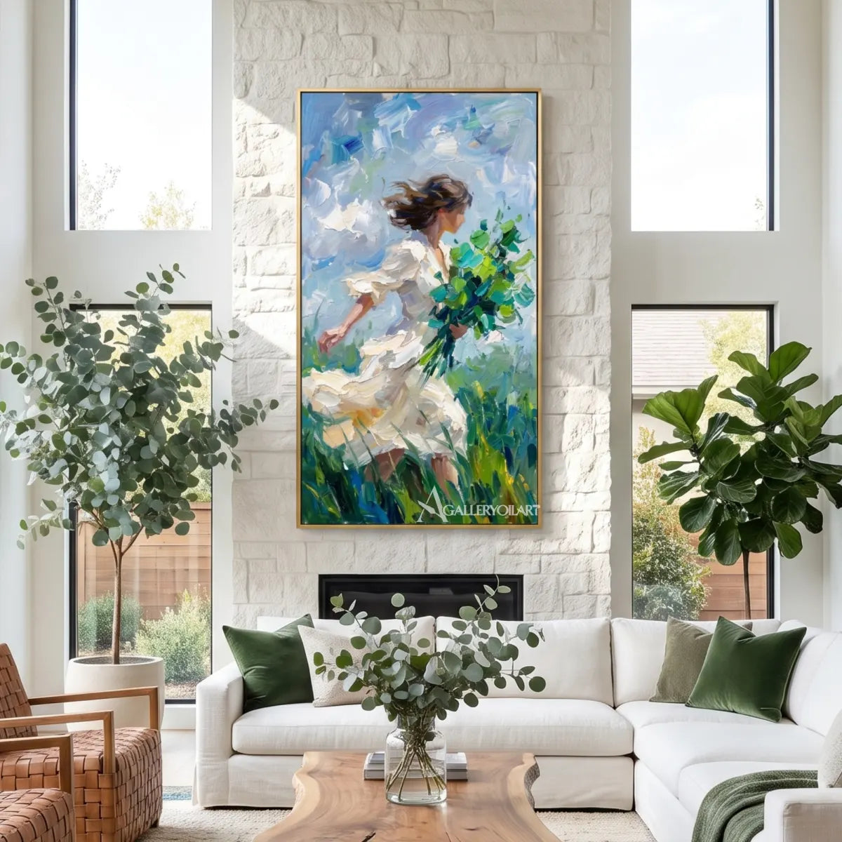 woman-in-flowing-dress-portrait-art-blue-and-white-wall-art-in-a-light-filled-living-room