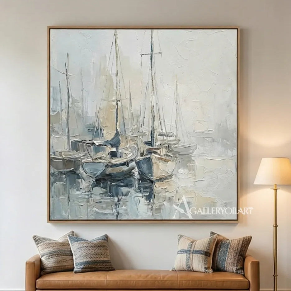 Quiet-sailboat-harbor-sea-beach-blue-wall-art-above-a-leather-bench