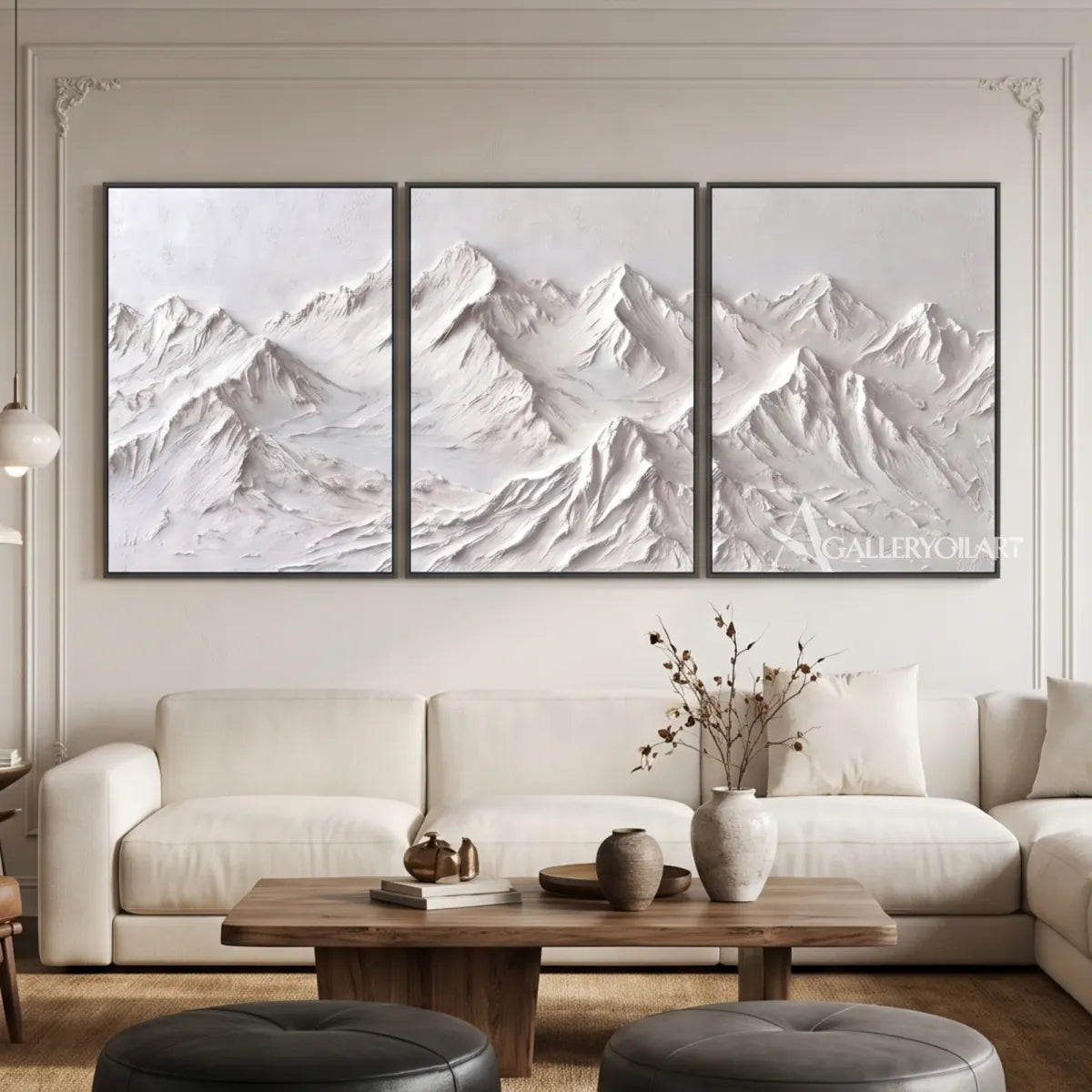 White-textured-mountain-ridge-triptych-above-a-neutral-sofa