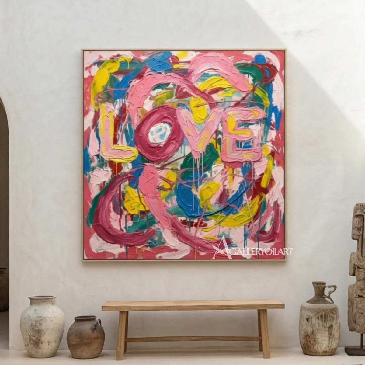 Pop art painted LOVE letters in pink, blue, yellow, green, and white wall art in art room