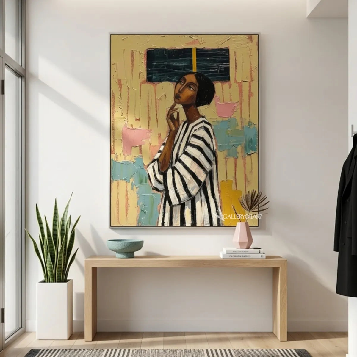 Portrait-art-painting-of-a-woman-in-a-black-and-white-striped-top-against-textured-yellow-and-teal-in-an-entryway