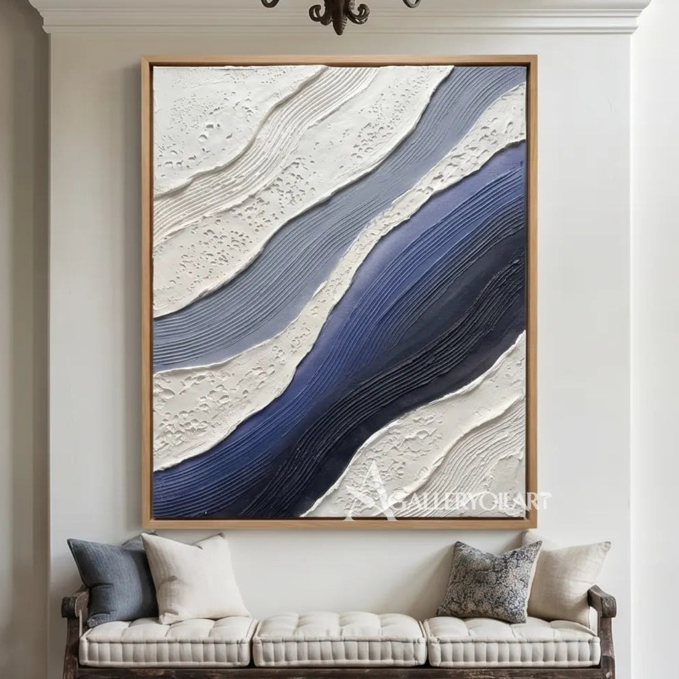flowing raised bands sweeping diagonally across the canvas in blue and ivory textured 3d art wall art in a living room setting