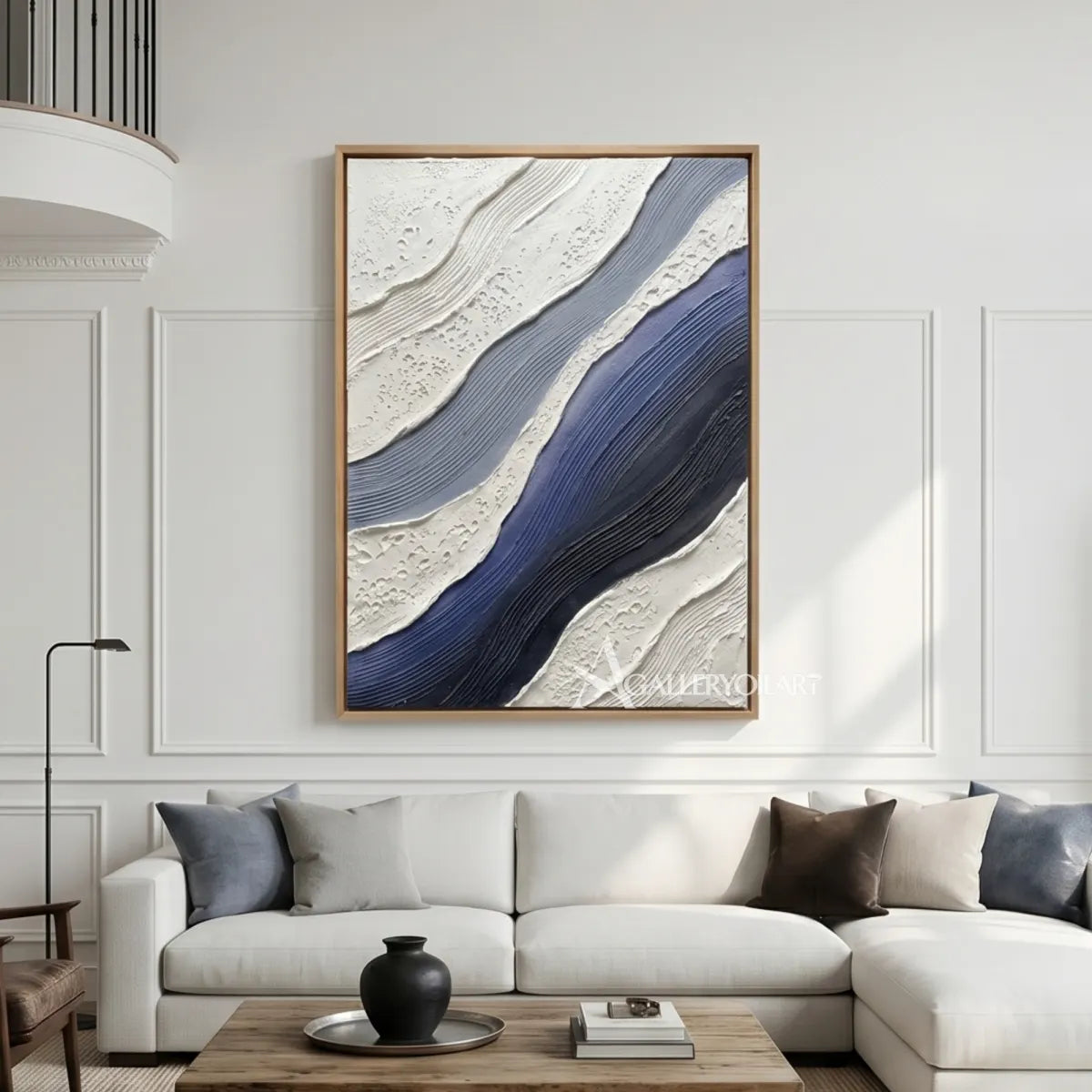 flowing raised bands sweeping diagonally across the canvas in blue and ivory textured 3d art wall art in a minimal interior setting
