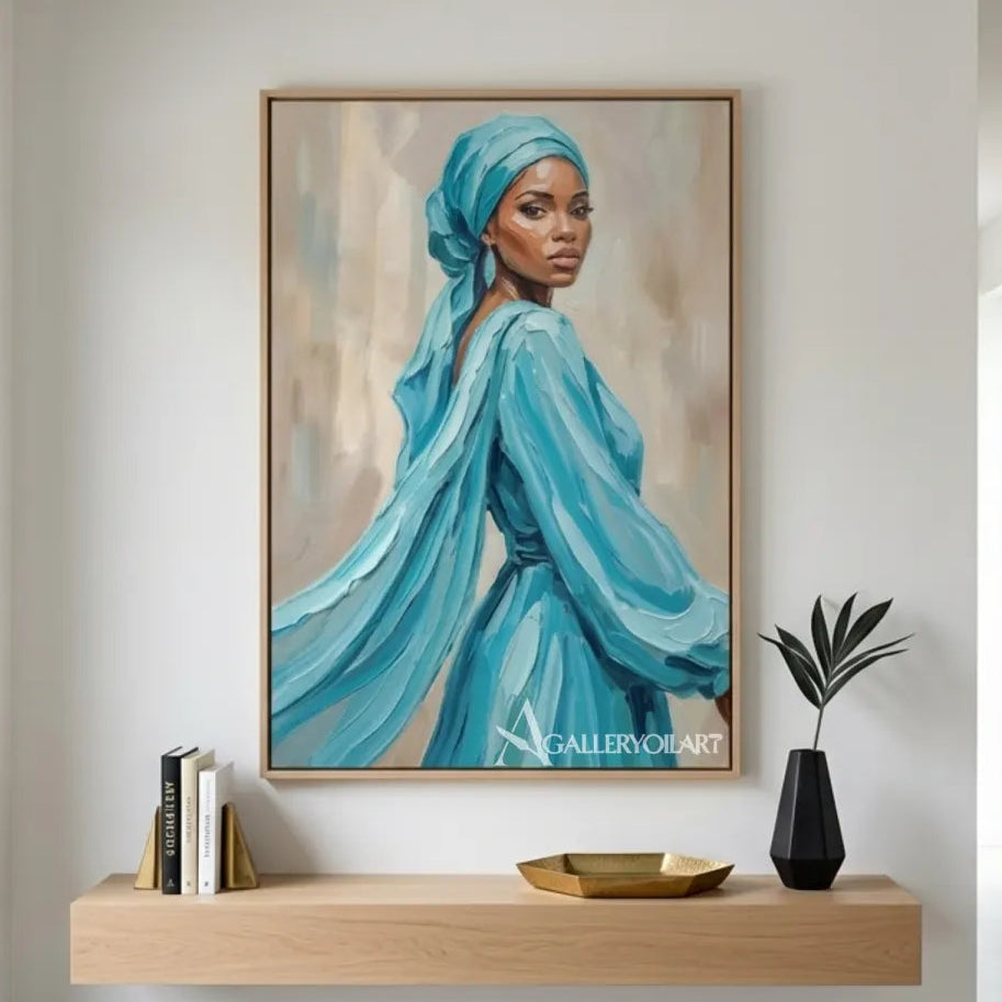 Woman-in-a-flowing-turquoise-headwrap-and-dress-in-portrait-art-blue-reading-lounge