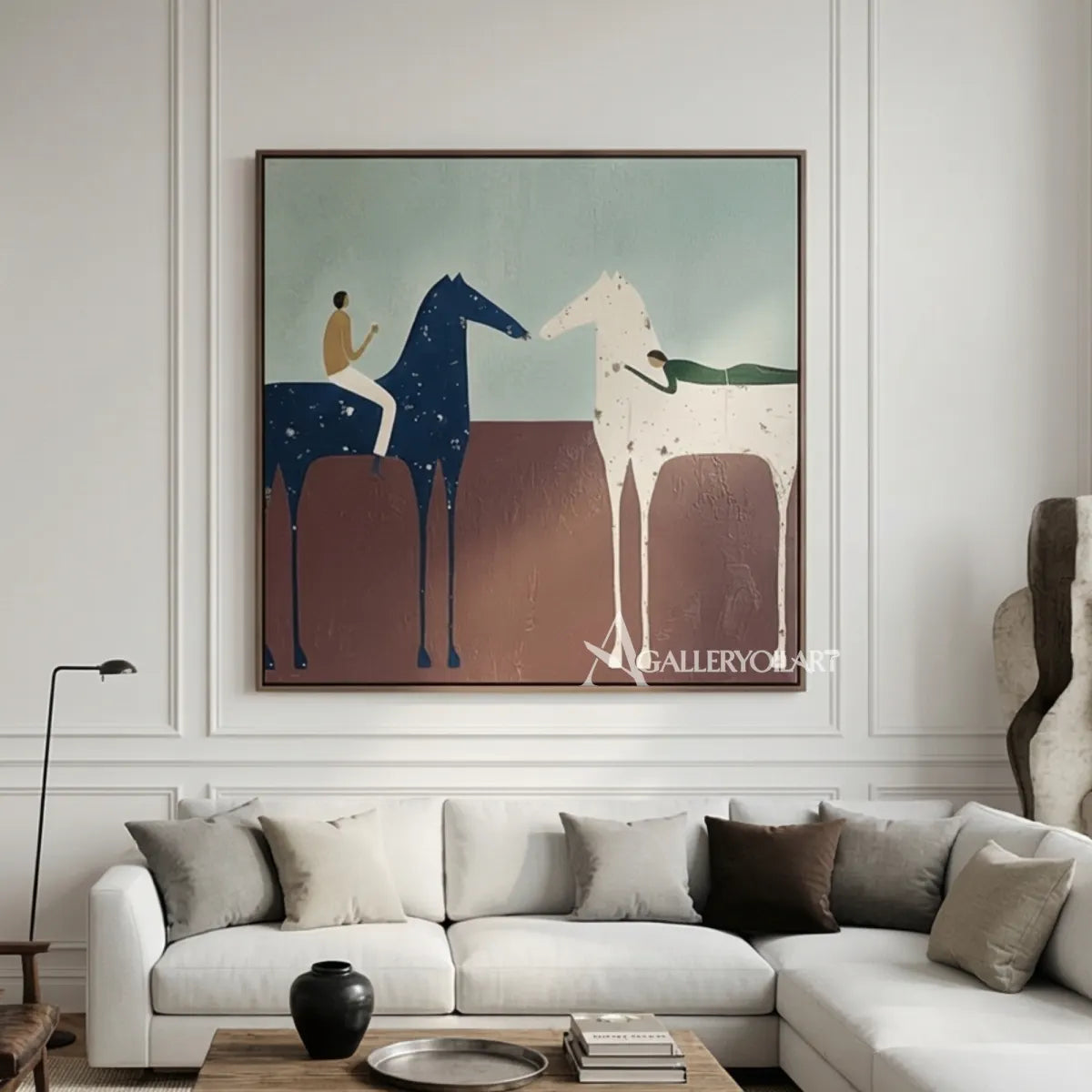 Western-cowboy-art-of-a-rider-on-a-blue-horse-meeting-a-pale-horse-across-a-rust-brown-field-above-a-sofa