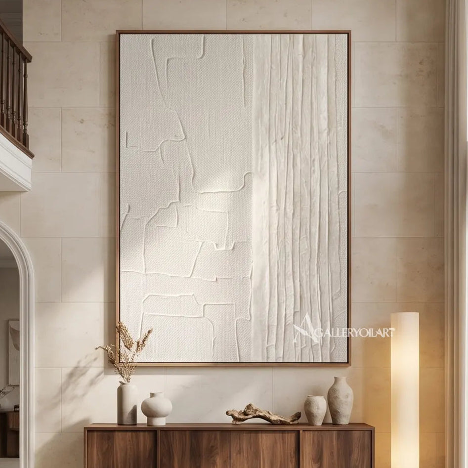 Textured-3D-white-split-surface-abstract-painting-above-an-entryway-console