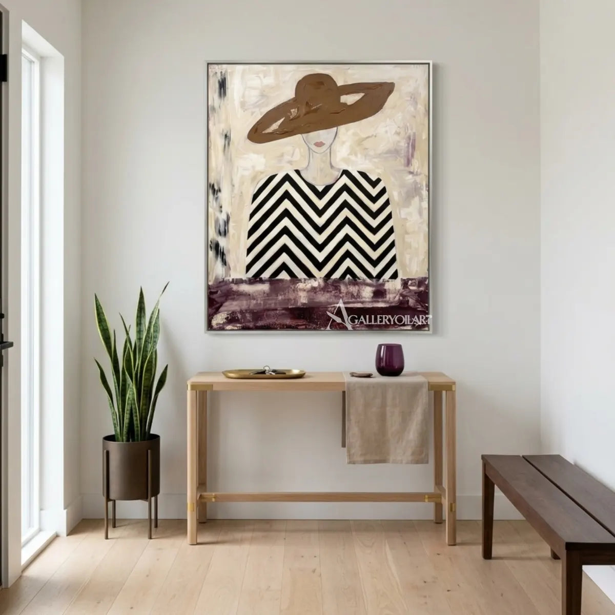 Woman-in-wide-hat-and-chevron-patterned-blouse-portrait-art-displayed-in-a-modern-entryway