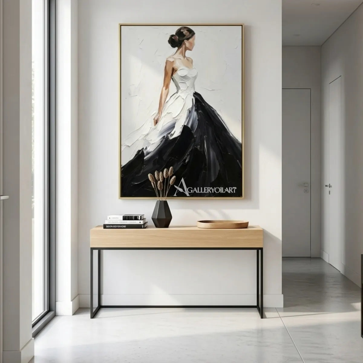 Woman-in-a-flowing-black-and-white-gown-in-portrait-art-displayed-in-a-modern-entryway