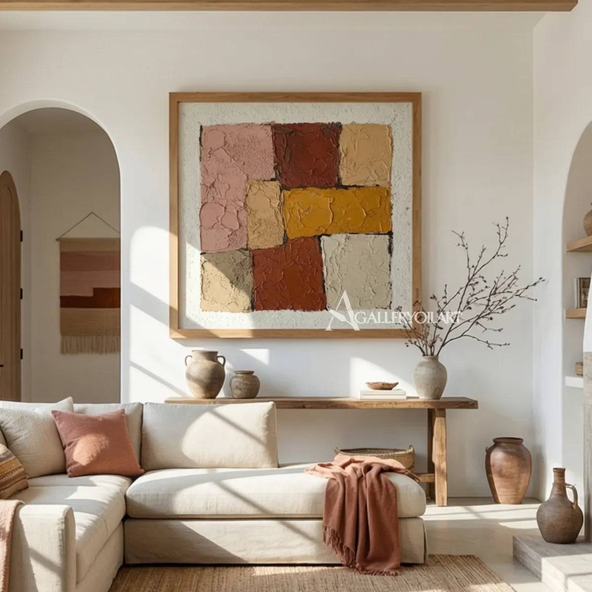 square-abstract-color-blocks-in-warm-clay-cream-and-ochre-above-a-wooden-bench