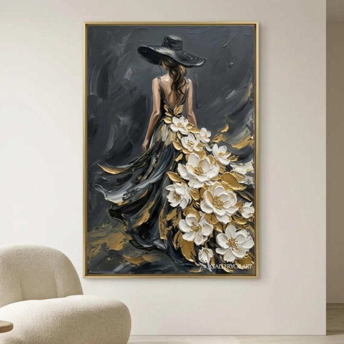 Woman-in-flowing-black-gown-with-white-floral-accents-portrait-art-in-a-light-seating-area