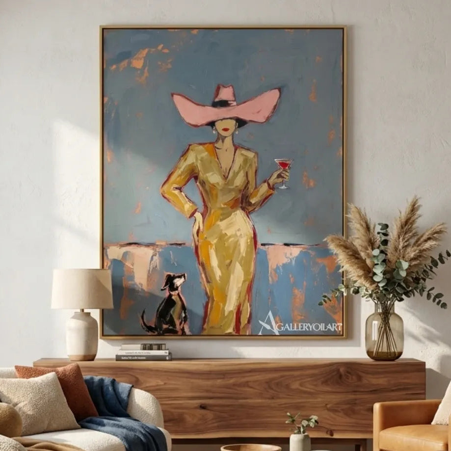 Woman-in-a-pink-wide-brim-hat-holding-a-cocktail-in-pop-art-blue-wall-art-in-lounge