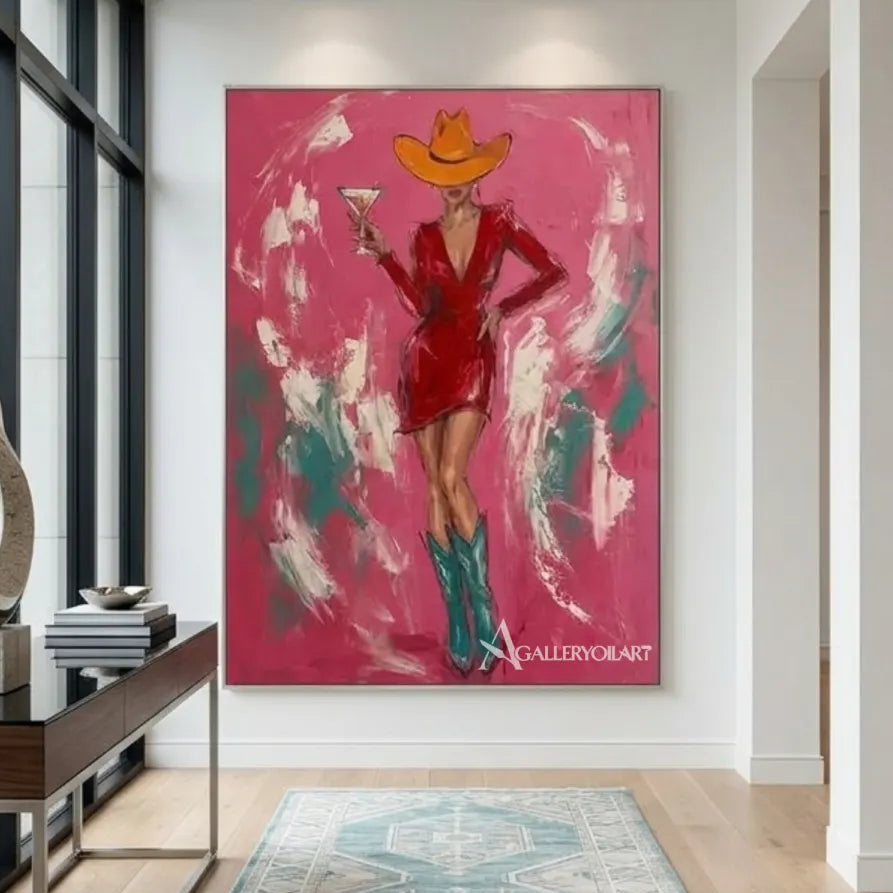 Woman-in-a-cowboy-hat-holding-a-cocktail-in-pop-art-pink-wall-art-in-entryway