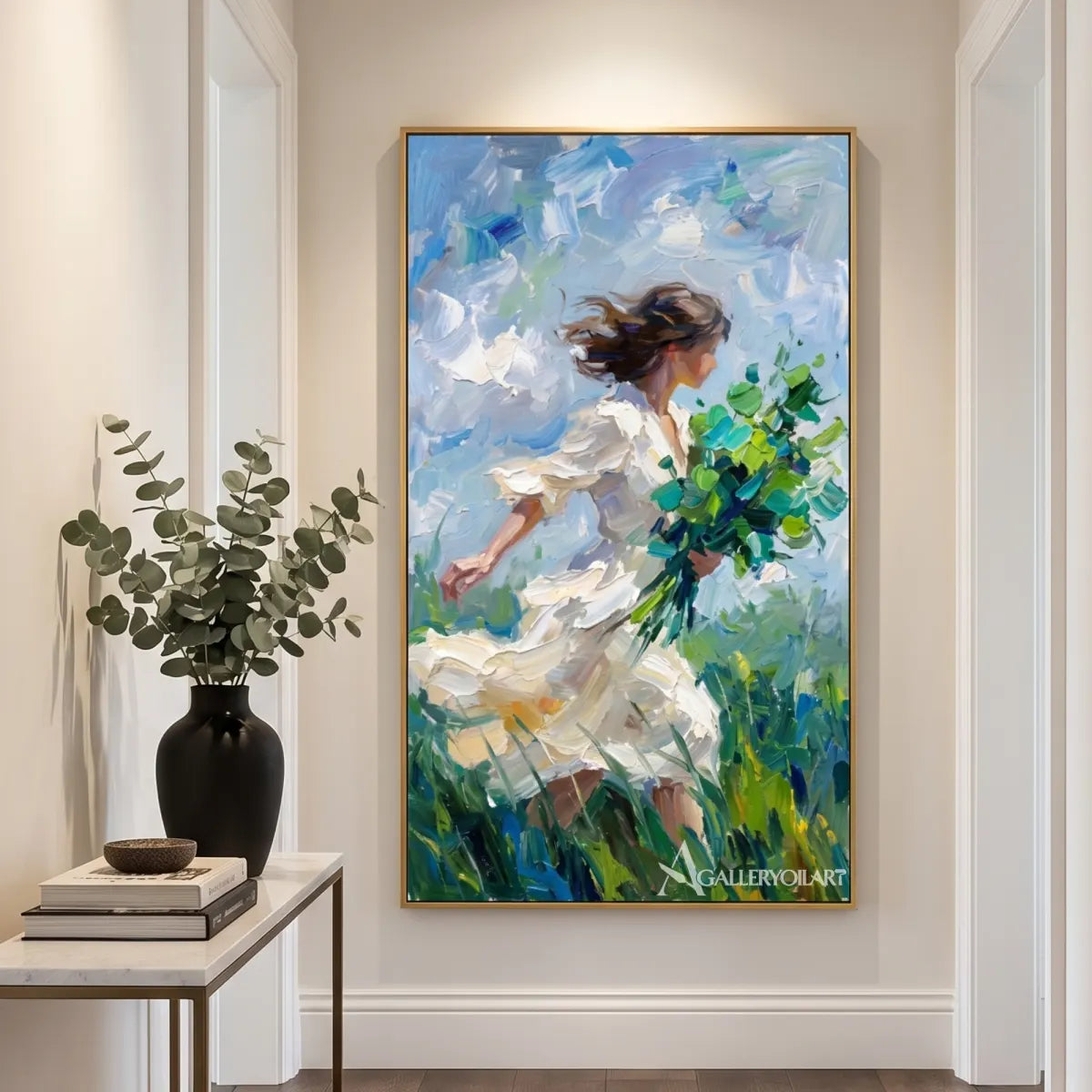 woman-in-flowing-dress-portrait-art-blue-and-white-wall-art-in-a-bright-entryway