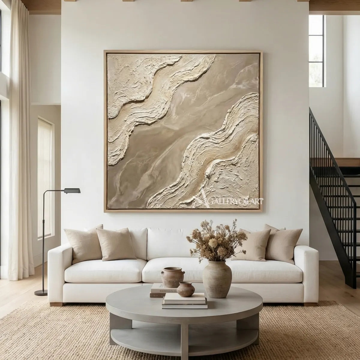 Divided-sculpted-currents-textured-3D-beige-wall-art-above-a-white-sofa