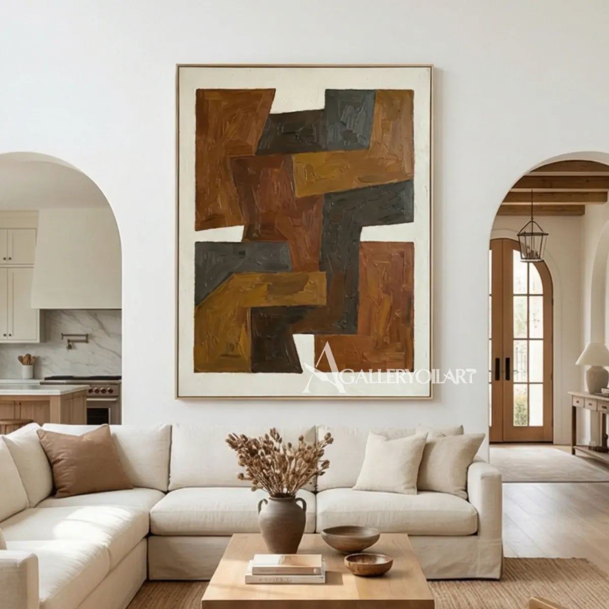 abstract-art-stepped-brown-and-charcoal-forms-above-a-sofa-in-a-bright-living-room