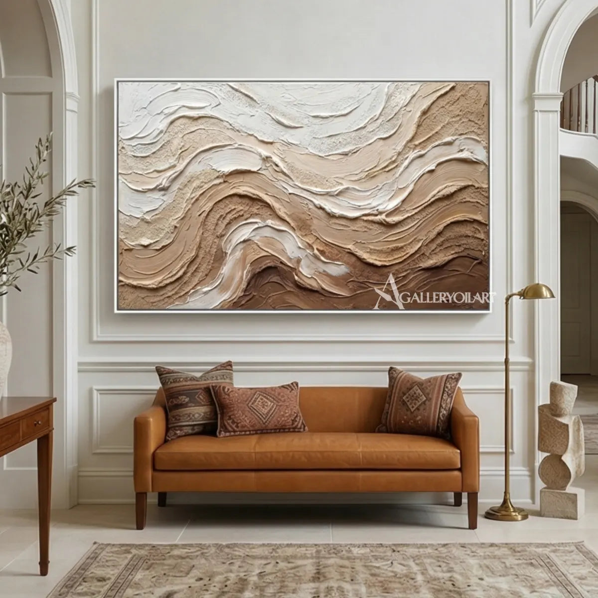 Layered-earthy-swells-textured-3D-brown-wall-art-above-a-caramel-leather-sofa