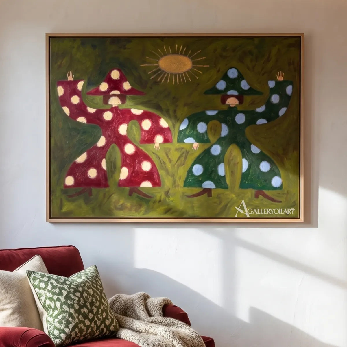 folk-art-mushroom-figures-in-green-and-burgundy-hung-over-a-sofa-in-a-bright-living-room