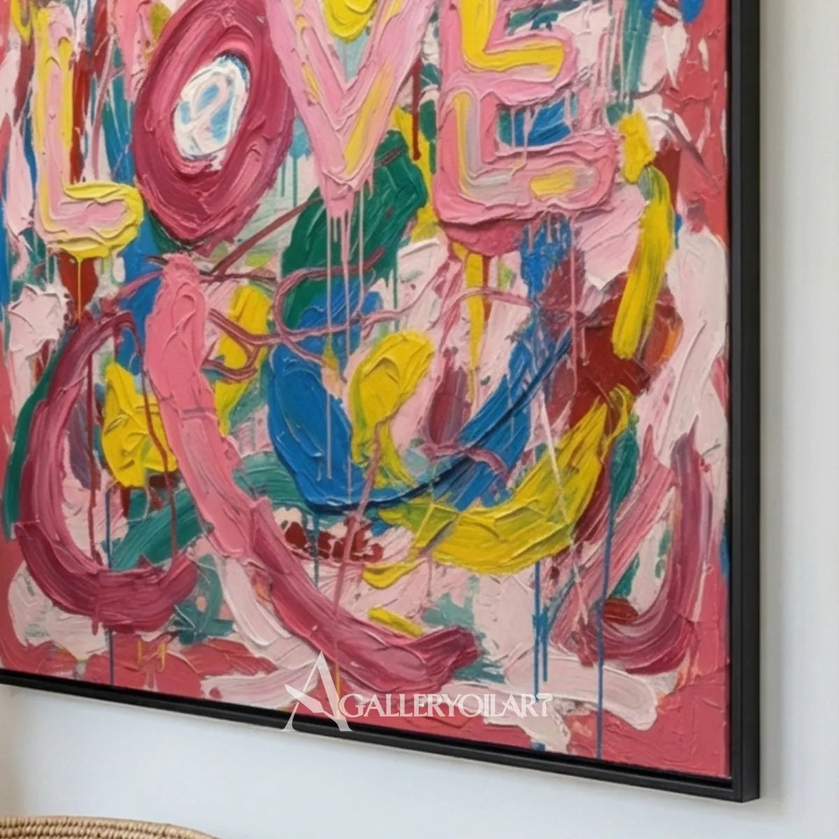 Pop art painted LOVE letters in pink, blue, yellow, green, and white wall art in close view