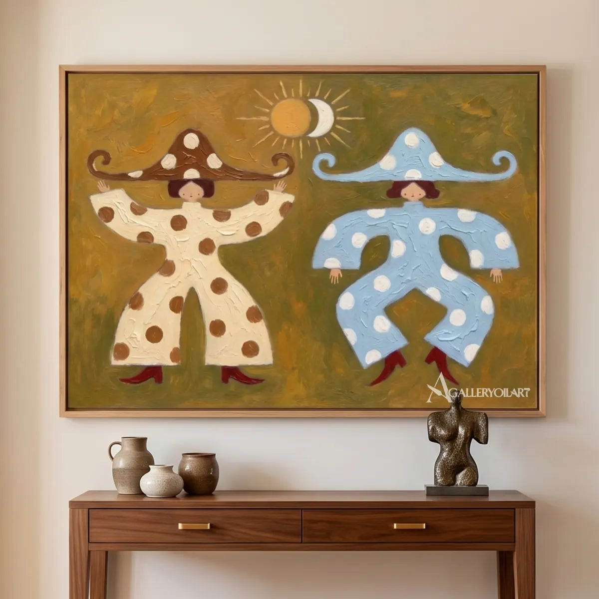 folk-art-pair-in-cream-and-blue-above-a-console-in-an-entryway