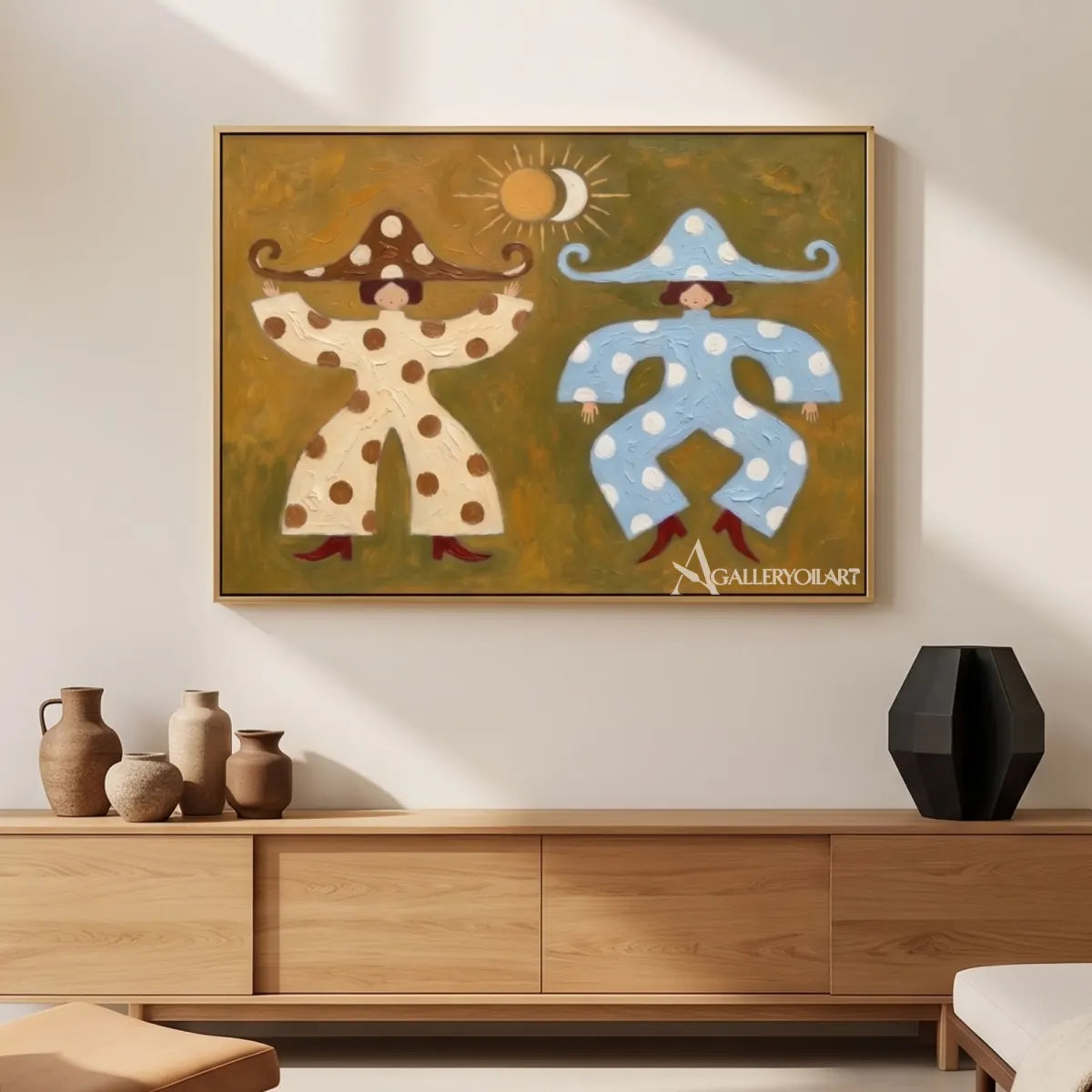 folk-art-figures-in-cream-and-blue-hung-above-a-sideboard