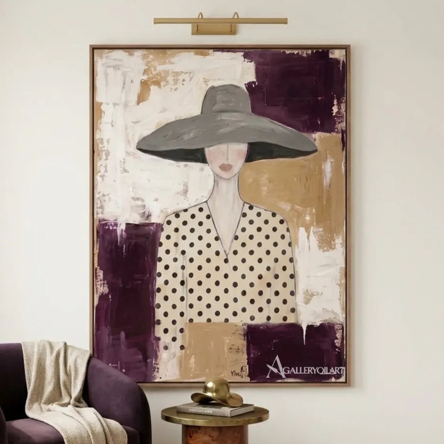 Woman-in-gray-wide-brimmed-hat-and-polka-dot-blouse-portrait-art-above-a-purple-lounge-chair-with-cream-tones