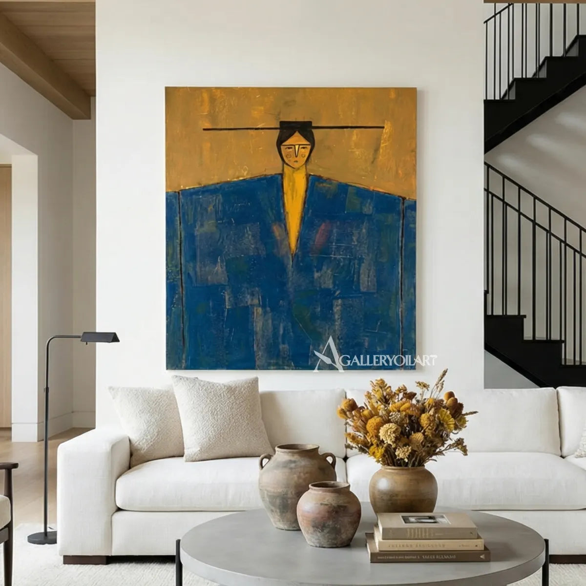 solitary-figure-portrait-art-in-blue-and-ochre-hanging-in-a-contemporary-lounge