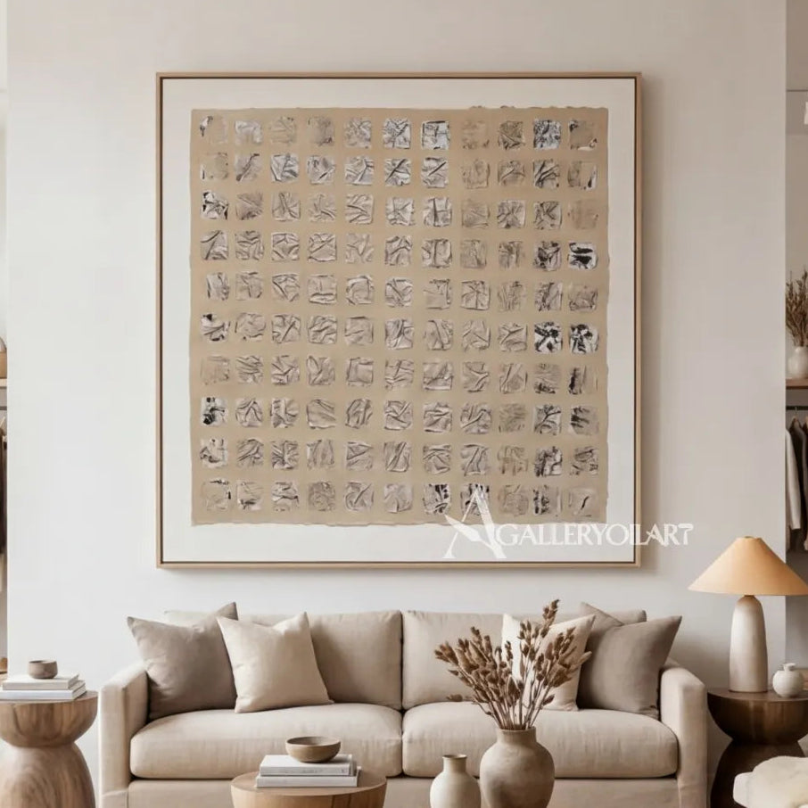 abstract-art-repeated-beige-script-like-marks-above-neutral-sofa