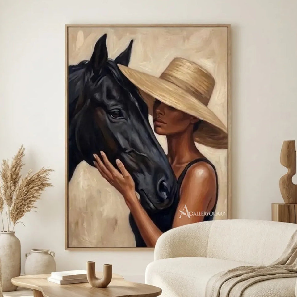 Woman-in-a-tan-hat-leaning-close-to-a-black-horse-in-a-warm-neutral-painting-in-gallery-room