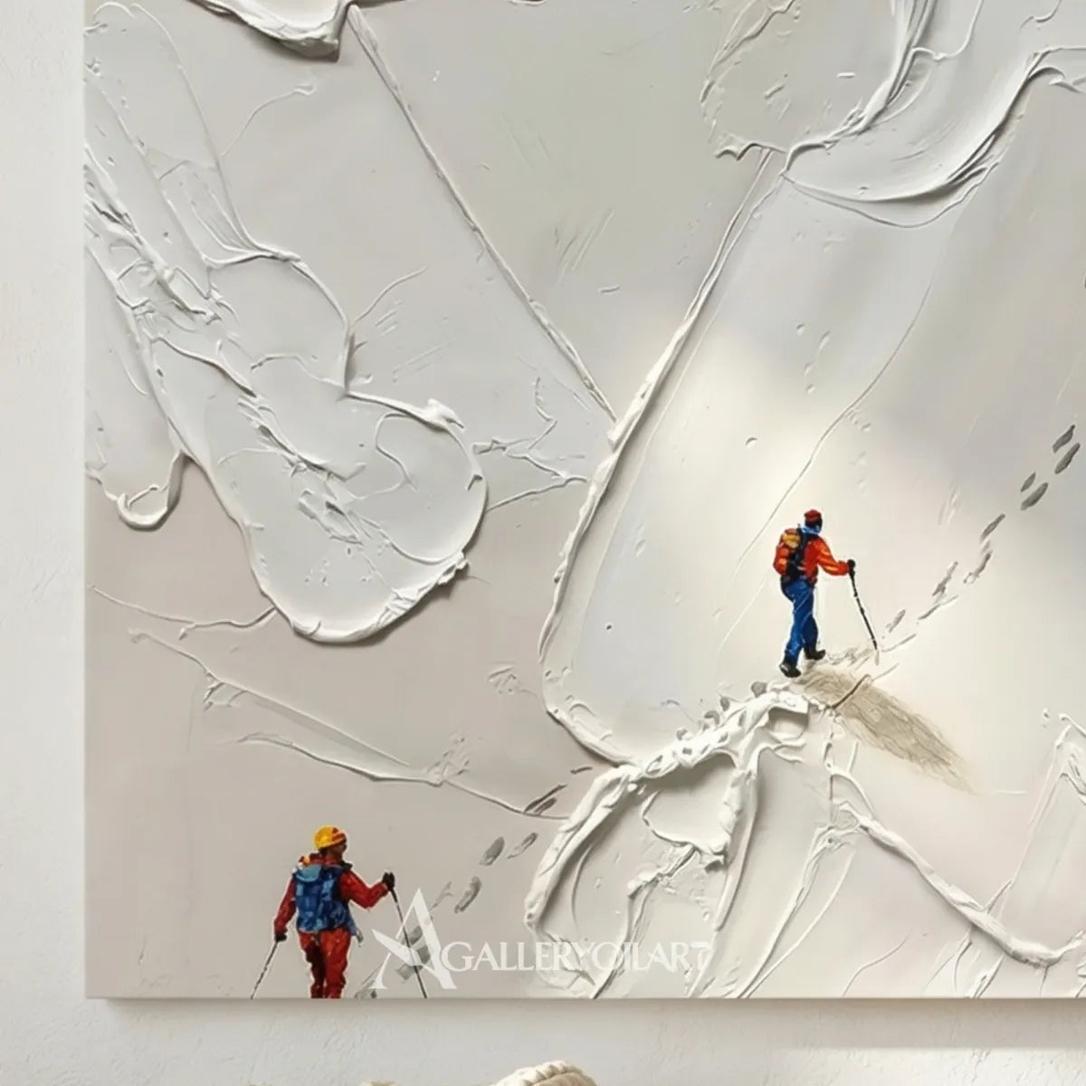 Close-up-of-textured-3D-art-showing-colorful-skiers-on-a-raised-white-mountain-slope
