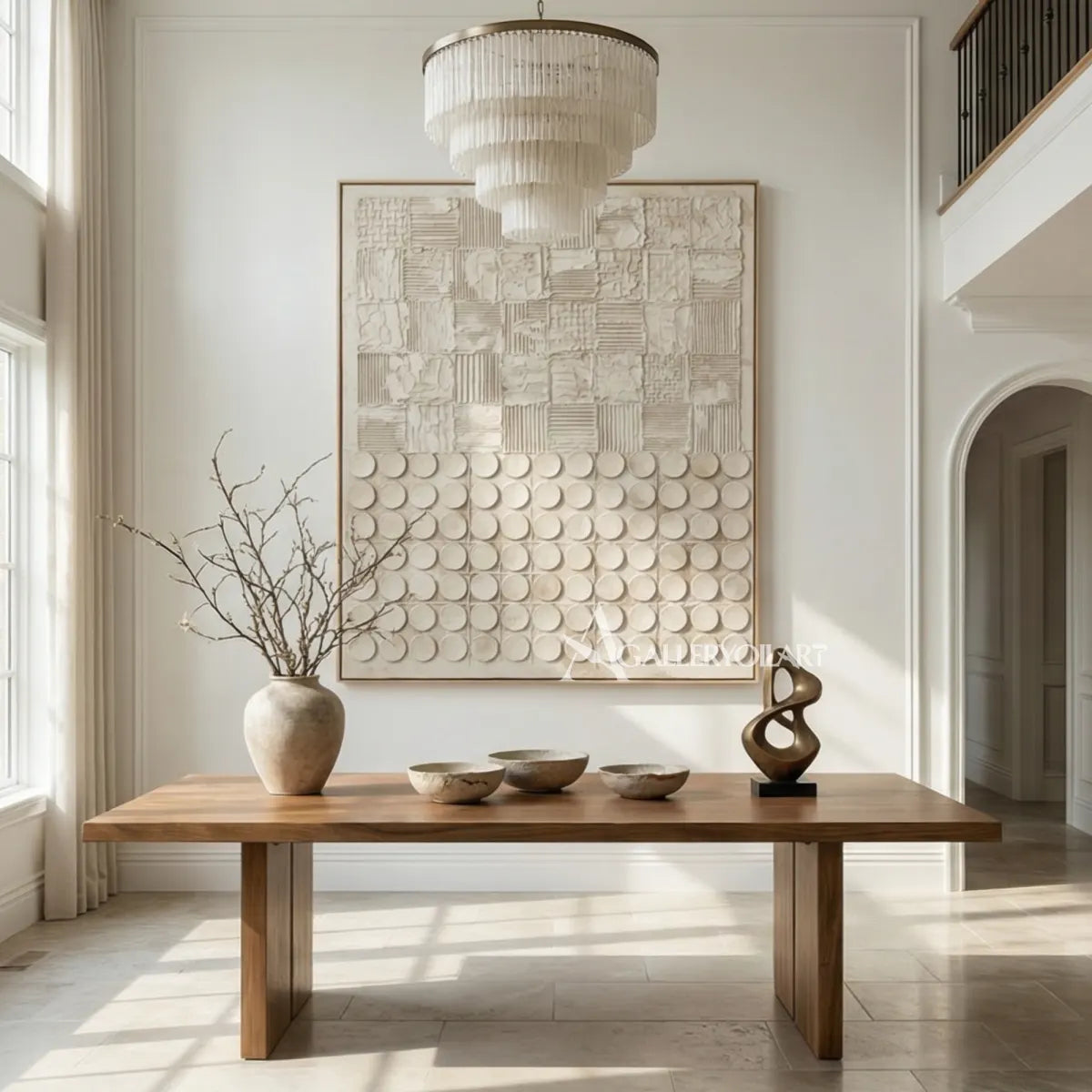 Textured 3D patchwork relief art in warm beige and ivory in a dining room