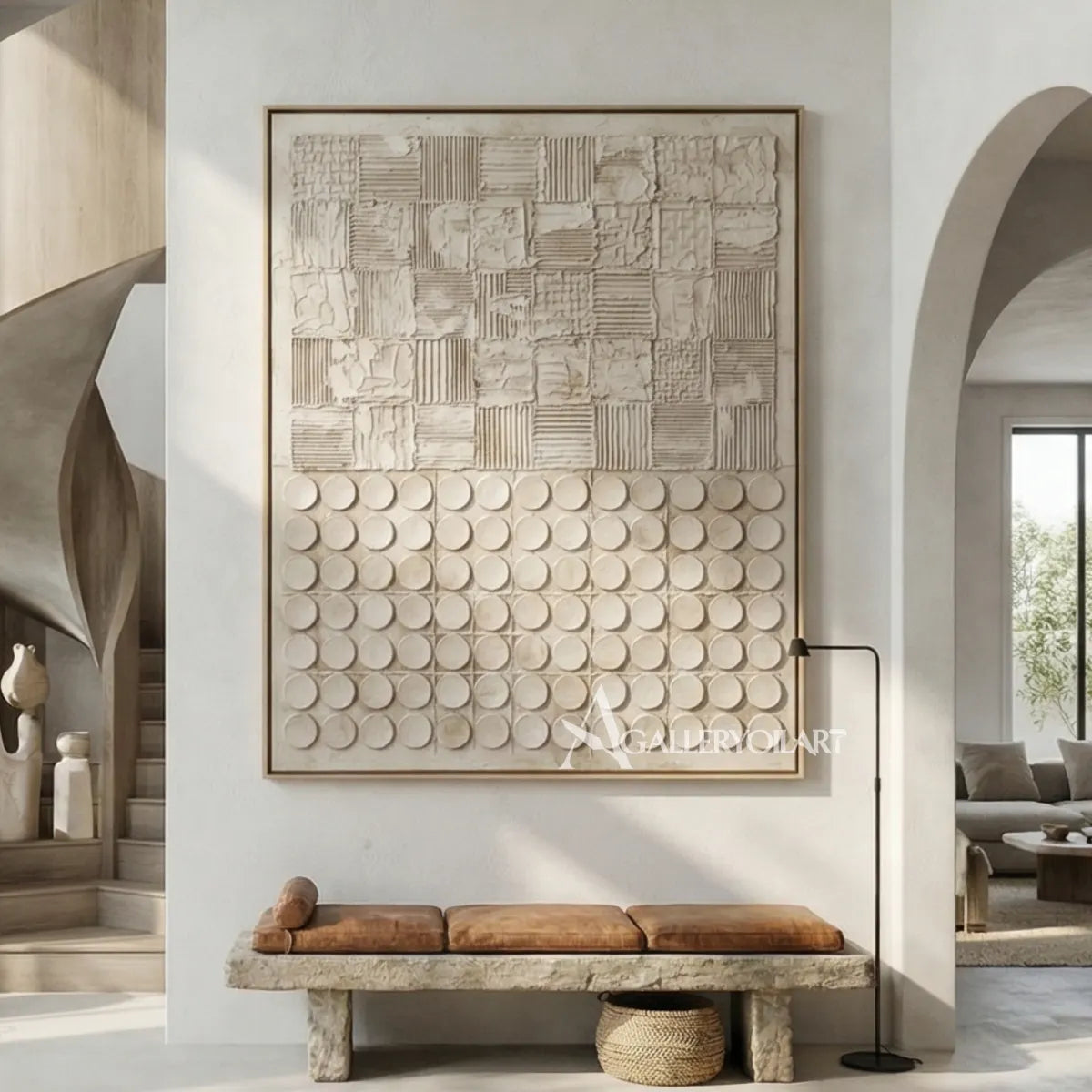 Textured 3D patchwork relief art in warm beige and ivory above a living room sofa