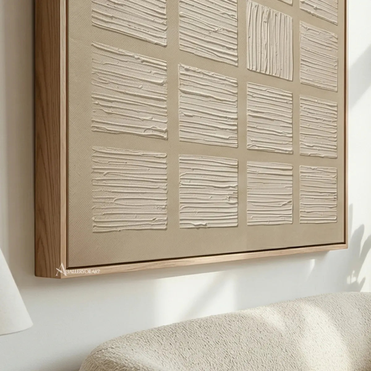 textured-3d-a-grid-of-raised-panels-ivory-cream-sand-beige-and-light-taupe-wall-art-in-angled-view
