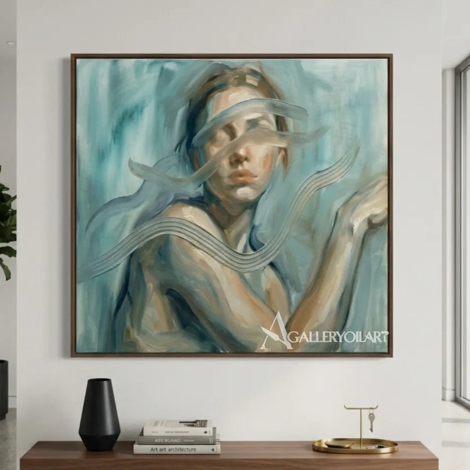 Woman-in-flowing-fabric-across-her-face-in-blue-toned-portrait-art-displayed-in-a-gallery-interior