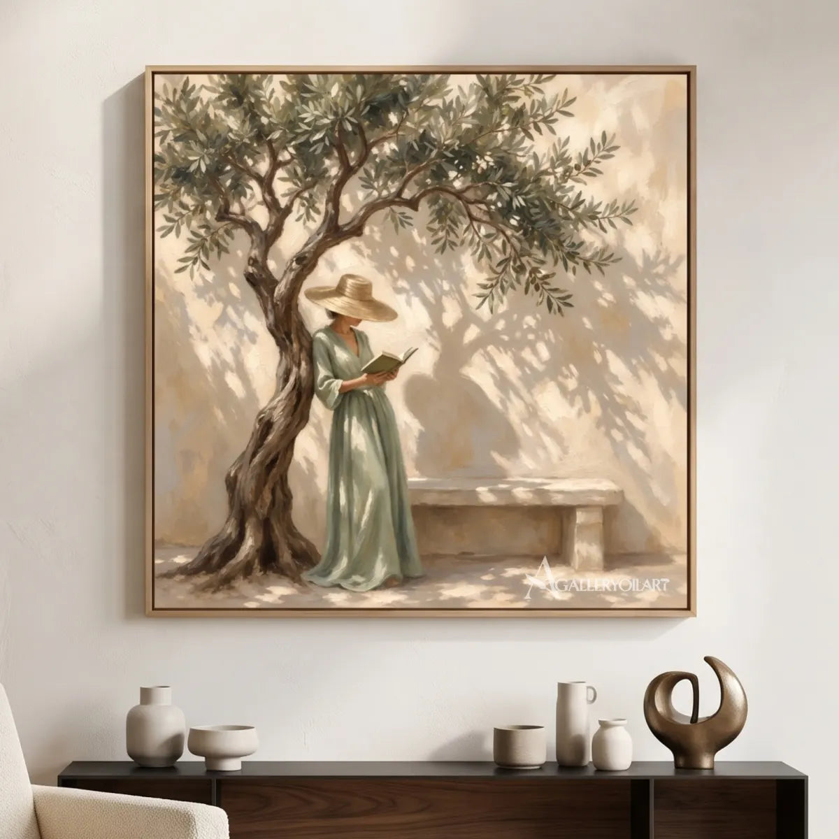 A woman reading beneath an olive tree in textured square Portrait Art above a dark console, with beige and green tones