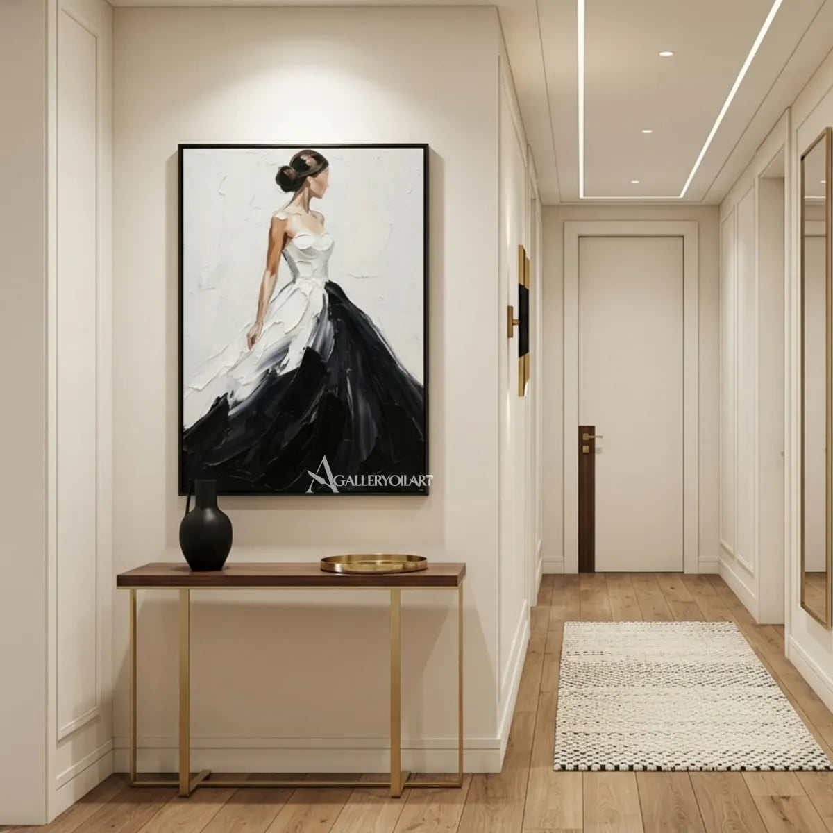 Woman-in-a-flowing-black-and-white-gown-in-portrait-art-displayed-in-a-minimalist-entryway