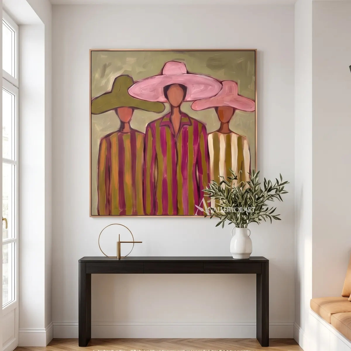 stylized-women-beneath-broad-brims-portrait-art-pink-and-olive-wall-art-above-a-console-table